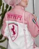 Woman wearing a stylish Pink Ferrari Jacket, a women’s Ferrari racing jacket with a sleek motorsport-inspired design, perfect for streetwear fashion.