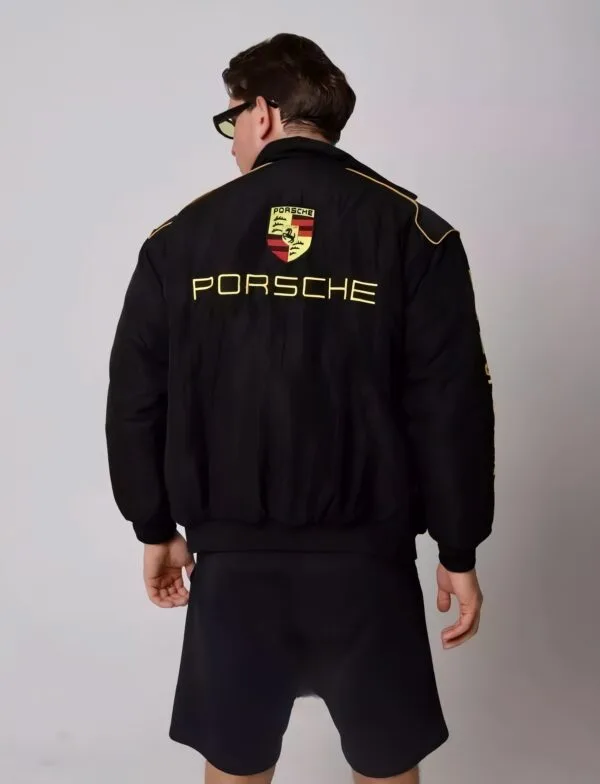 Model wearing the Porsche bomber jacket, pairing streetwear aesthetics with motorsport heritage.