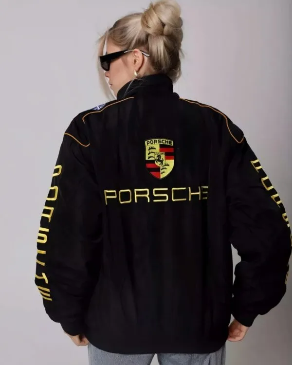 Close-up of the Porsche bomber jacket showcasing high-quality stitching and bold branding.