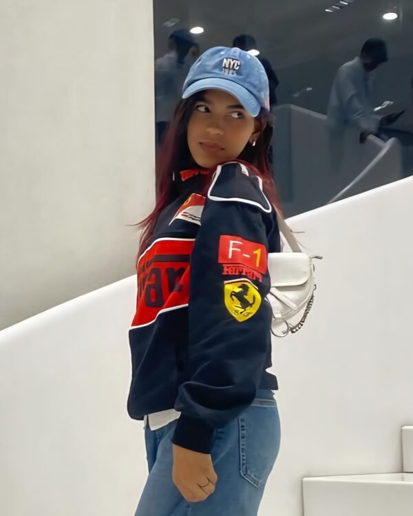 Close-up of Ferrari team logo on black F1 jacket