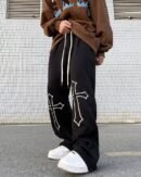 Close-up of cross print pants streetwear detail