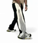 Flat lay of Zerodas oversized double zip track pants showcasing wide leg cut and dual side