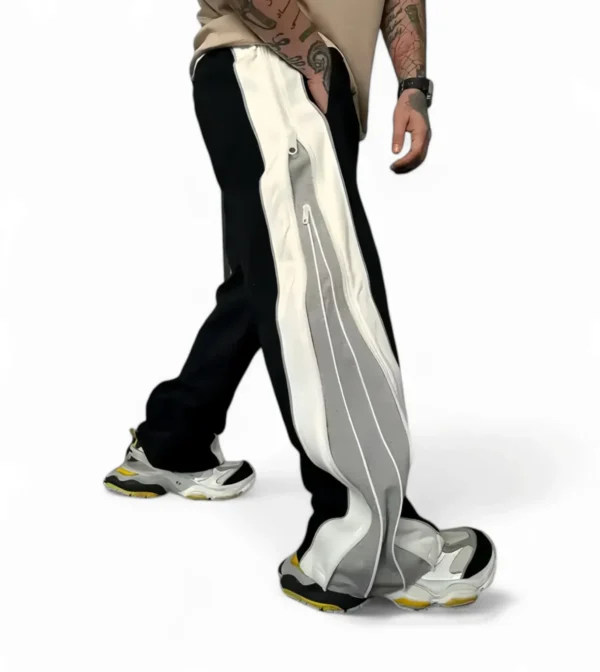 Flat lay of Zerodas oversized double zip track pants showcasing wide leg cut and dual side