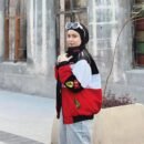 Ferrari zip-up jacket laid flat, showing full design, color, and detailing ideal for Formula 1 racing apparel lovers.