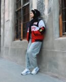 Back view of Ferrari F1 jacket featuring iconic prancing horse logo and Scuderia Ferrari text across the shoulders.