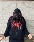 Folded black Spiderman zip-up hoodie with red spider logo