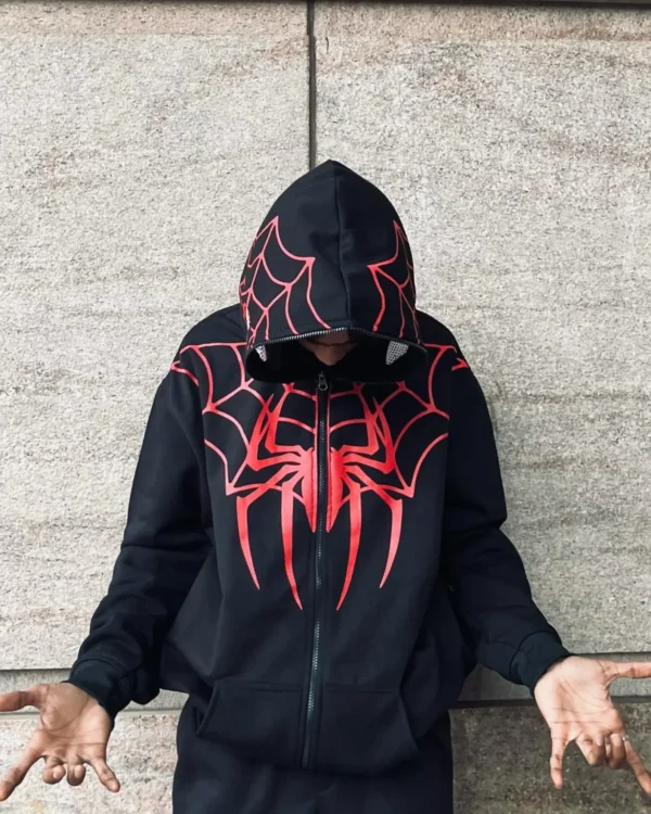 Folded black Spiderman zip-up hoodie with red spider logo