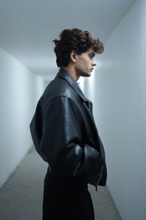Street-style look featuring black cropped leather jacket